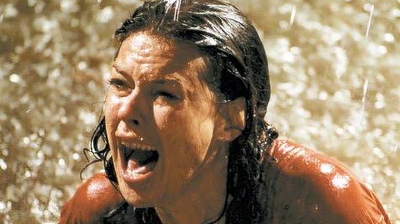 Diane stuck in the muddy hole with the skeletons in Poltergeist