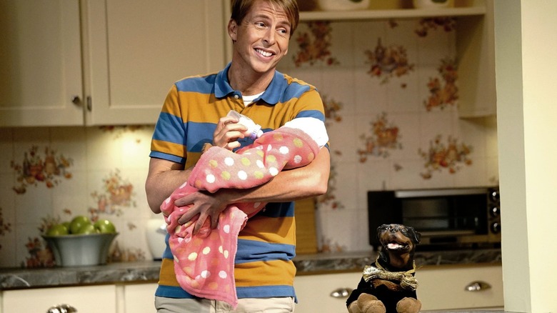 Jack and Triumph tending to a baby on "The Jack and Triumph Show" (2015)
