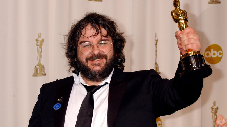 Peter Jackson posing with his Oscar for 