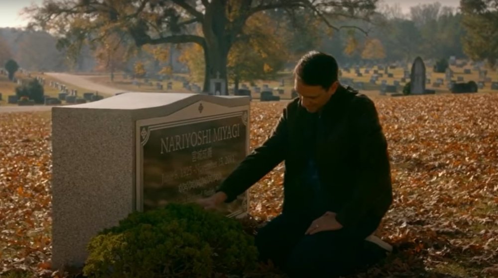 Ralph Macchio as Daniel LaRusso at Mr. Miyagi's grave in Cobra Kai