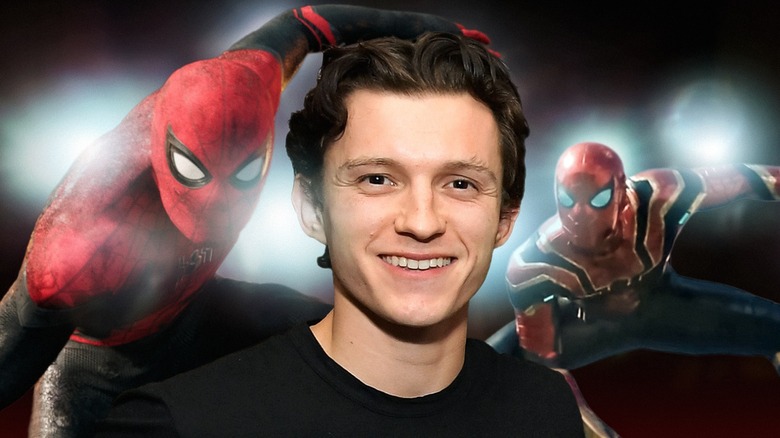 Tom Holland smiling with Spider-Men behind him