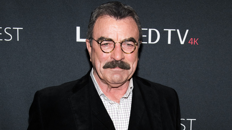 Tom Selleck posing for pictures