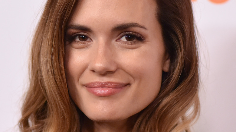 Torrey DeVitto smiling