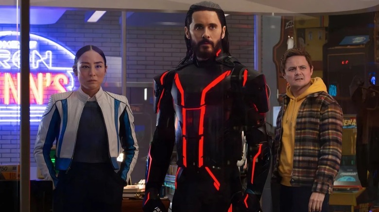 Ares protecting his human friends in Tron: Ares