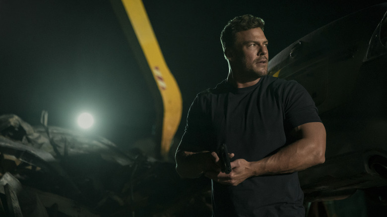 Reacher draws his gun on a night mission in 