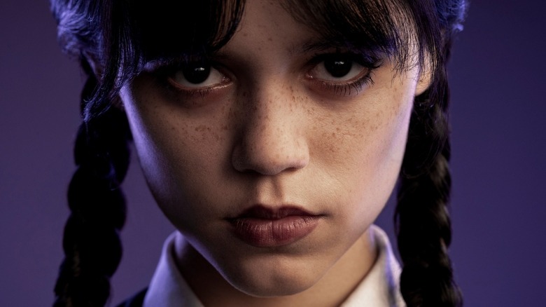 Jenna Ortega staring ahead as Wednesday Addams