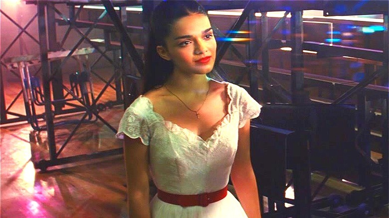 Maria standing behind the bleachers