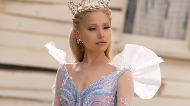 Glinda standing next to Dorothy's house in Wicked: For Good