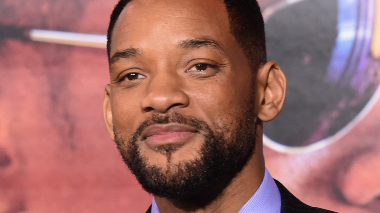 Will Smith posing in front of his own image