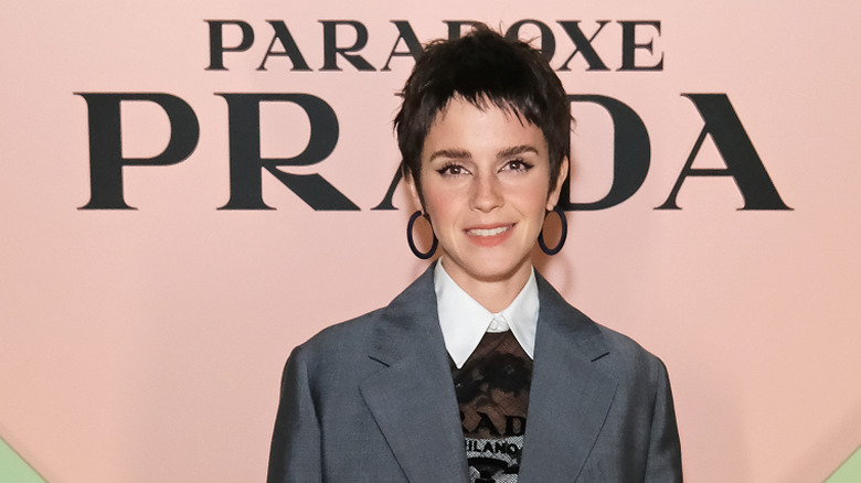 Emma Watson posing at a Prada Paradoxe event