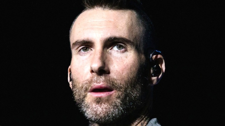 Adam Levine performing