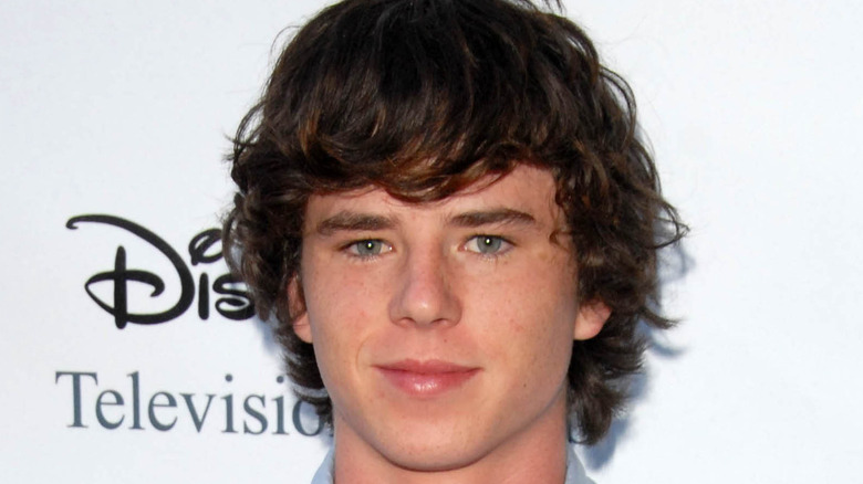 Charlie McDermott smirking