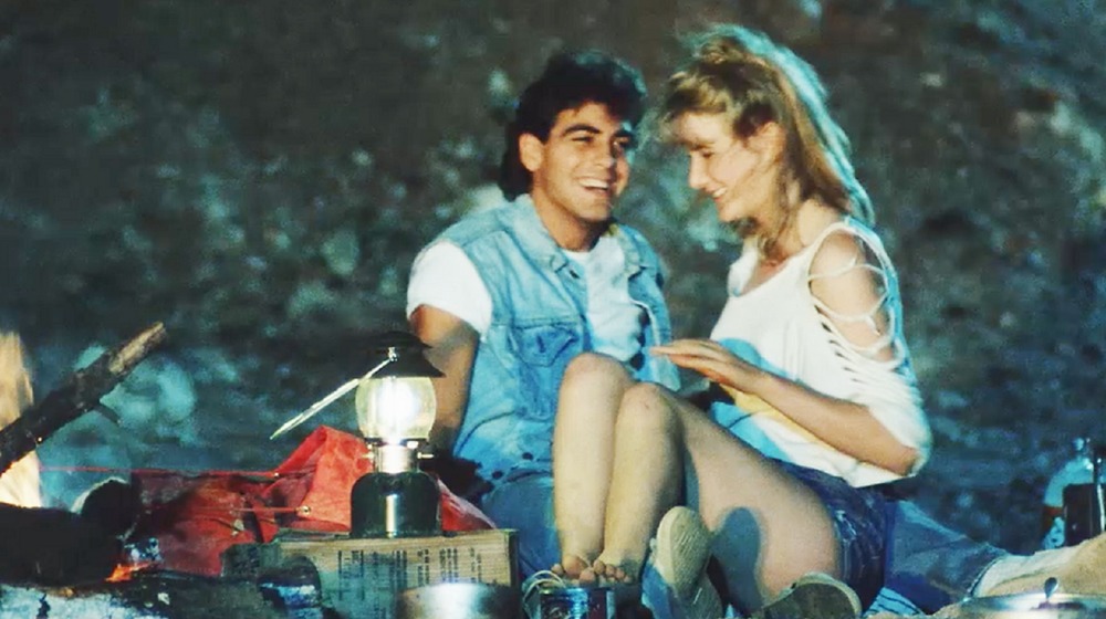 George Clooney and Laura Dern in Grizzly II: The Predator