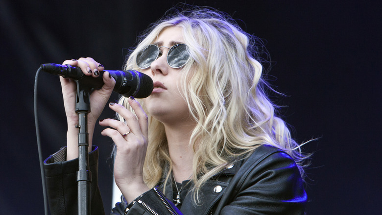 Taylor Momsen holds microphone