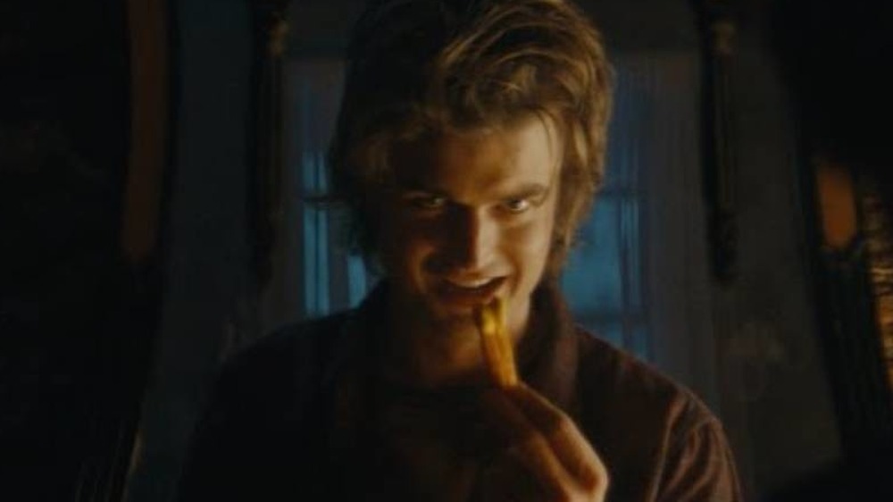 Joe Keery eating nacho fries