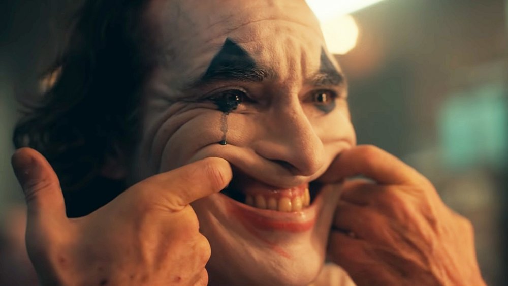 Joaquin Phoenix Joker smile in the mirror