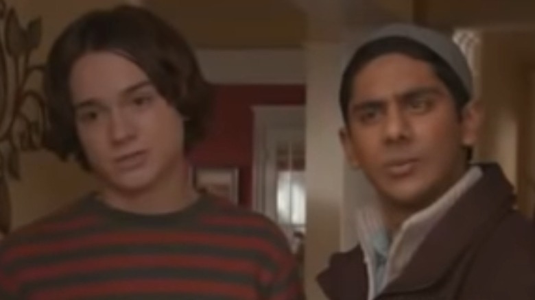 Justin Tolchuk and Raja Musharaff standing