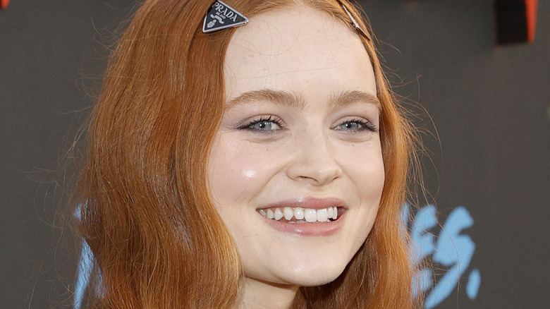 Sadie Sink smiles at press