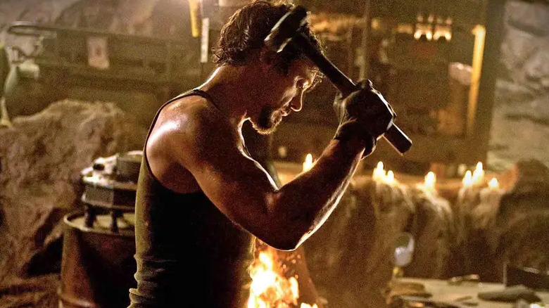 Robert Downey Jr. lifts a hammer
