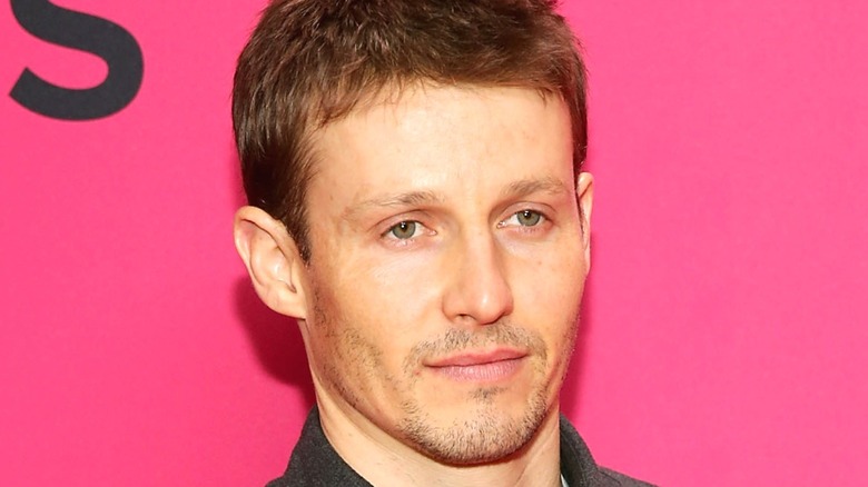 Will Estes against pink background