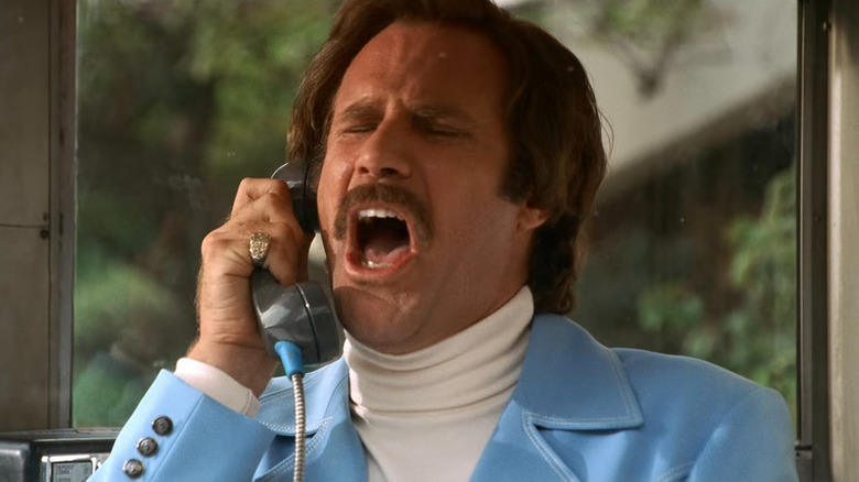 Ron Burgundy yelling in a phone booth in 
