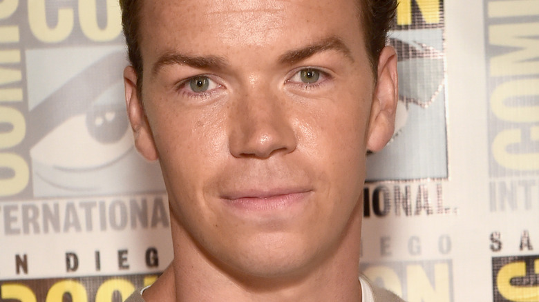 Will Poulter grinning