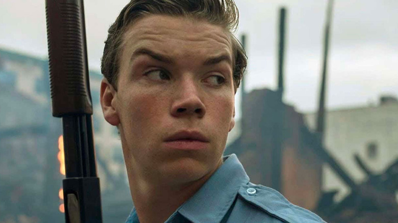 Will Poulter holding a shotgun in Detroit