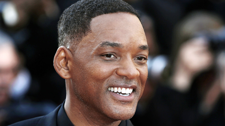 Will Smith smiles