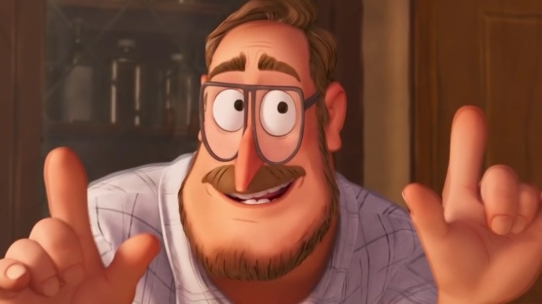 Rick Mitchell smiles at table