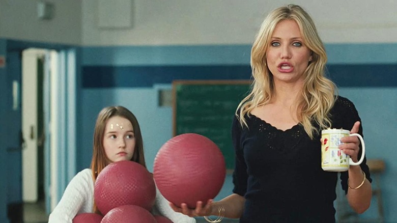 Cameron Diaz holds a volleyball