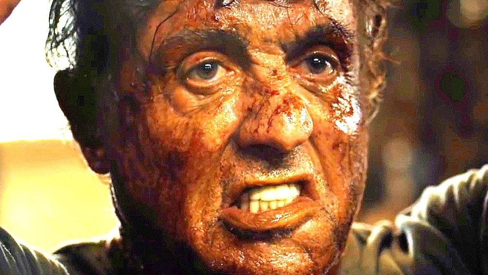 John Rambo grimacing, covered in blood