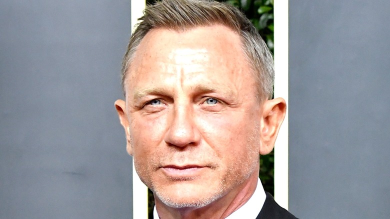 Daniel Craig smiling on red carpet