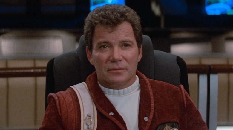 Kirk sits in captain's chair