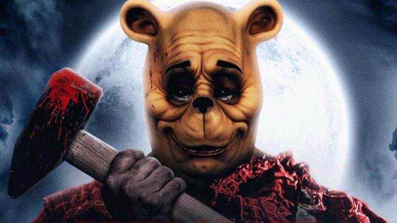 Winnie the Pooh holding an exe in Blood and Honey