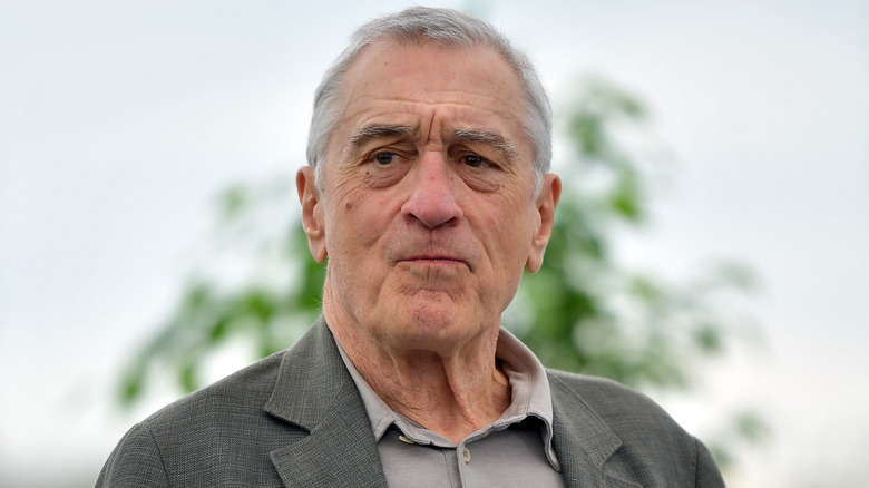 Robert De Niro in front of tree