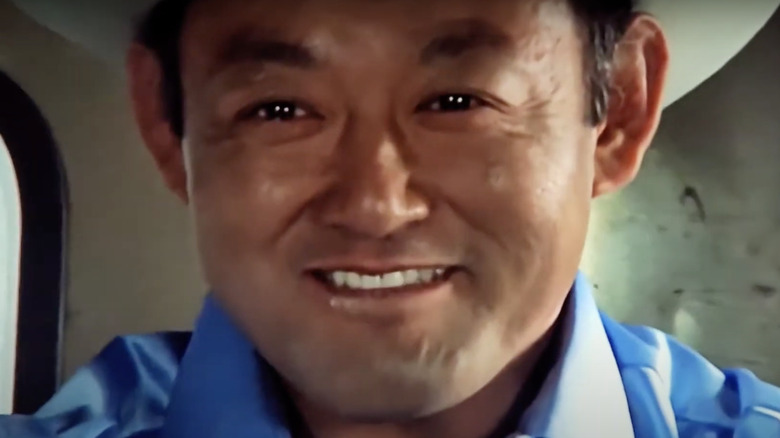 Bill Saito smiling driving truck in Smokey and the Bandit