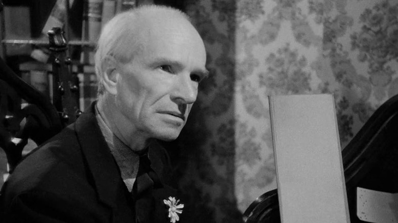 Ian Wolfe signing a guestbook in They Live by Night
