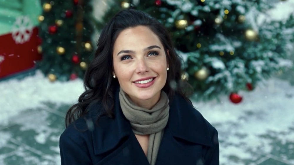 Diana Prince smiling in snow looking up