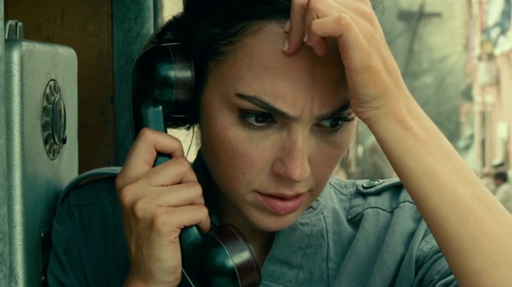 Gal Gadot as Diana holding phone