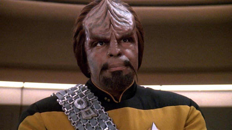 Worf standing on the deck of the Enterprise-D in 