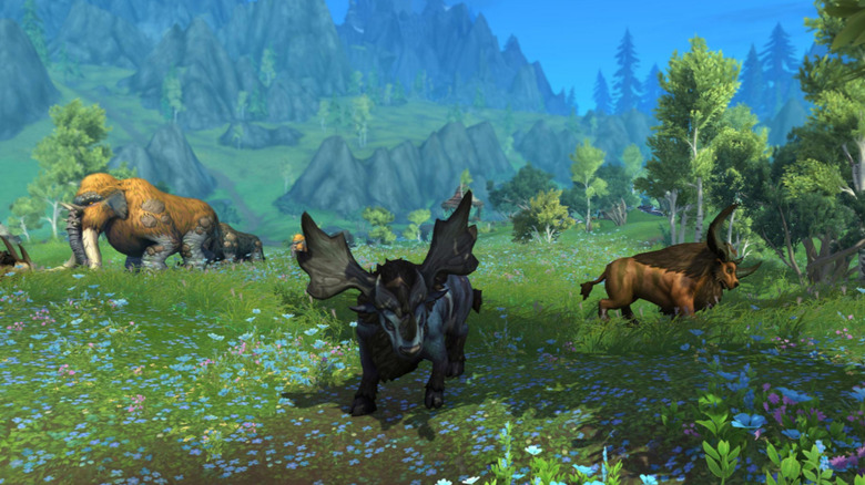 Animals in lush green field