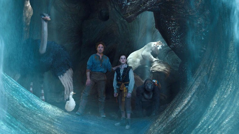 Dr. Dolittle and his animals witnessing a watery entrance opening up in Dolittle (2020)