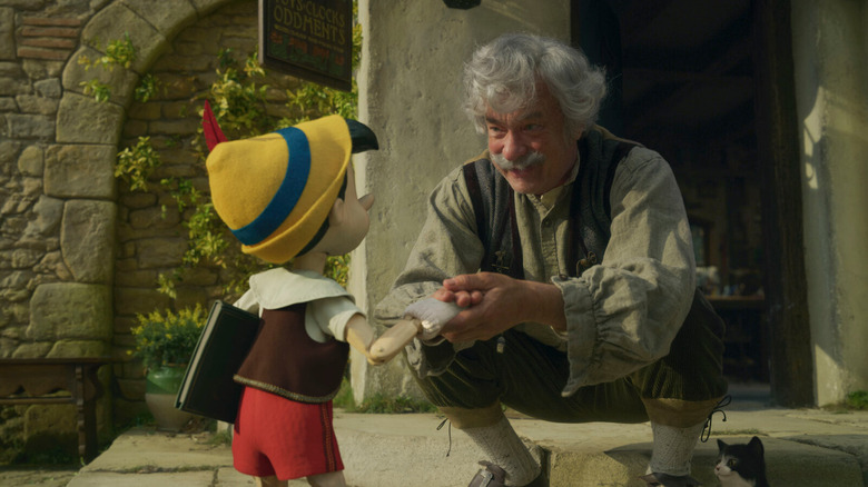 Geppetto bidding farewell to Pinocchio in Pinocchio (2022)