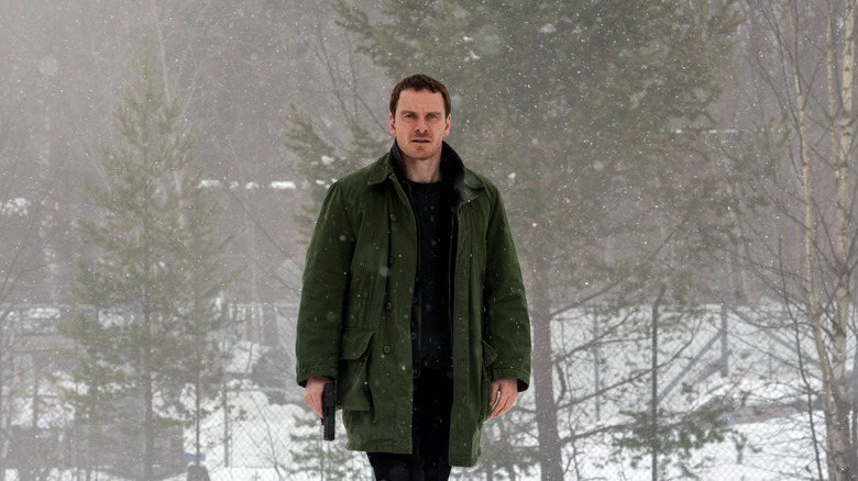 Harry Hole looking confused in the snow in The Snowman (2017)