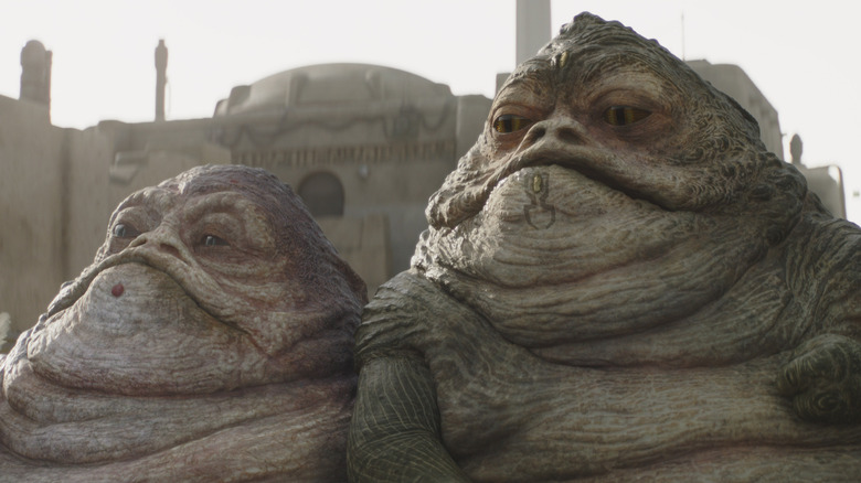 A pair of Hutts sitting side-by-side in The Book of Boba Fett (2021)