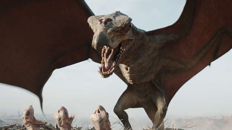 A shriek-hawk landing over its nest and waiting babies in season 3 of The Mandalorian (2023)