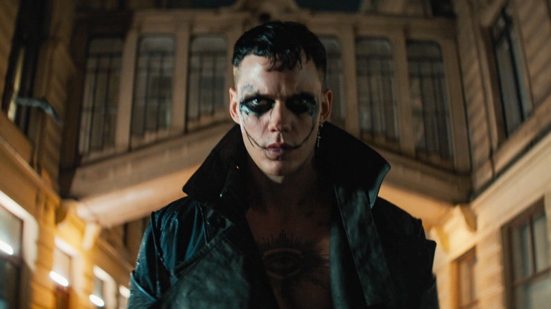 Eric Draven standing in his signature trench coat in "The Crow"