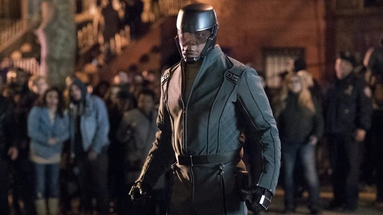 Diamondback surrounded by people in "Luke Cage"