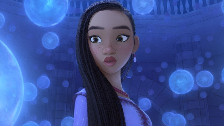 Asha looking at orbs in Wish (2023)