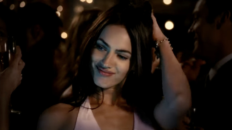 Megan Fox runs hand through hair